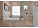 Spa-like bathroom with soaking tub and walk-in shower at 13487 W Roy Rogers Rd, Peoria, AZ 85383