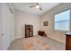 Cozy bedroom featuring a built-in shelving unit and area rug at 13487 W Roy Rogers Rd, Peoria, AZ 85383