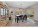 Dining area with a wooden table and chairs, and access to the backyard at 13487 W Roy Rogers Rd, Peoria, AZ 85383