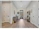 Bright entryway with wood-look tile floors and stylish storage at 13487 W Roy Rogers Rd, Peoria, AZ 85383