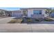 Single-story home with a two-car garage and desert landscaping at 13487 W Roy Rogers Rd, Peoria, AZ 85383