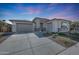 Single story home with two-car garage and desert landscaping at 13487 W Roy Rogers Rd, Peoria, AZ 85383