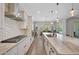 Modern kitchen with white cabinets, a large island, and stainless steel appliances at 13487 W Roy Rogers Rd, Peoria, AZ 85383