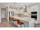 Modern kitchen with white cabinets, quartz countertops, and stainless steel appliances at 13487 W Roy Rogers Rd, Peoria, AZ 85383