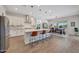 Modern kitchen with white cabinets, a large island, and stainless steel appliances at 13487 W Roy Rogers Rd, Peoria, AZ 85383