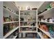 Well-organized pantry with ample shelving for storage at 13487 W Roy Rogers Rd, Peoria, AZ 85383