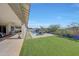 Covered patio overlooking the pool and grassy backyard at 13487 W Roy Rogers Rd, Peoria, AZ 85383