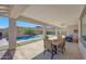 Covered patio with seating area and a view of the pool at 13487 W Roy Rogers Rd, Peoria, AZ 85383