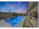 Inviting pool with a water feature, surrounded by a patio at 13487 W Roy Rogers Rd, Peoria, AZ 85383