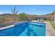 Relaxing backyard pool with tiled water feature and patio at 13487 W Roy Rogers Rd, Peoria, AZ 85383