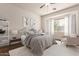 Serene bedroom with a large window and cozy seating area, creating a relaxing retreat at 13737 W Luke Ave, Litchfield Park, AZ 85340