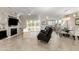 Bright living room with fireplace, recessed lighting, and sliding glass doors leading to the backyard at 16502 W Arroyo Ct, Surprise, AZ 85374