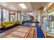 Well-lit hallway with display cases, creating an inviting entrance at 1560 E Riviera Dr, Chandler, AZ 85249