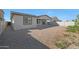Large backyard with gravel and some small plants at 26367 S 231St Way, Queen Creek, AZ 85142