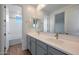 Bathroom with double vanity and grey cabinets at 26367 S 231St Way, Queen Creek, AZ 85142