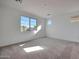 Bright bedroom with carpet flooring and large window at 26367 S 231St Way, Queen Creek, AZ 85142