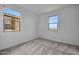 Bright bedroom with neutral walls and carpet at 26367 S 231St Way, Queen Creek, AZ 85142