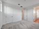 Well-lit bedroom with carpet and access to a bathroom at 26367 S 231St Way, Queen Creek, AZ 85142