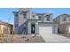 Two-story house with gray exterior, white garage door, and landscaping at 26367 S 231St Way, Queen Creek, AZ 85142