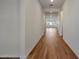 Bright hallway with wood-look tile flooring at 26367 S 231St Way, Queen Creek, AZ 85142