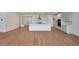 Open concept kitchen with island, stainless steel appliances, and light cabinets at 26367 S 231St Way, Queen Creek, AZ 85142