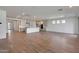 Open concept kitchen with island, stainless steel appliances, and light cabinets at 26367 S 231St Way, Queen Creek, AZ 85142