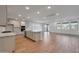 Open concept kitchen with island, stainless steel appliances, and light cabinets at 26367 S 231St Way, Queen Creek, AZ 85142