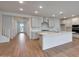 Open concept kitchen with island, stainless steel appliances, and light cabinets at 26367 S 231St Way, Queen Creek, AZ 85142
