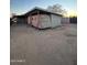 Large backyard with covered patio and vintage trailer at 3546 W Roosevelt St, Phoenix, AZ 85009