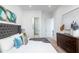 Spacious bedroom with plush bed and gray tufted headboard at 4050 N 12Th St # 1, Phoenix, AZ 85014
