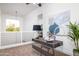 Spacious loft with a desk, seating area and large window at 4050 N 12Th St # 1, Phoenix, AZ 85014