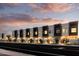 Modern townhome community with attached garages, sleek design, and landscaped grounds at 4050 N 12Th St # 3, Phoenix, AZ 85014