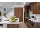 Modern kitchen with island, stainless steel appliances, and wood cabinetry at 4050 N 12Th St # 3, Phoenix, AZ 85014