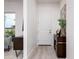 Bright entryway with white door and wood flooring at 4050 N 12Th St # 6, Phoenix, AZ 85014