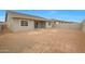 Backyard view of home featuring unfinished landscaping, fenced yard, and covered patio at 44713 N 44Th Dr, Phoenix, AZ 85087