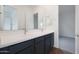 Double sink vanity in bathroom with a view into a bedroom at 44713 N 44Th Dr, Phoenix, AZ 85087