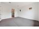 Bedroom with neutral carpeting, white walls and entry into the ensuite bathroom at 44713 N 44Th Dr, Phoenix, AZ 85087