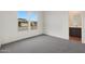 Neutral bedroom showcasing the plush carpeting and two windows at 44713 N 44Th Dr, Phoenix, AZ 85087