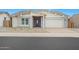 Attractive one-story house boasting a stone-accented entrance, a brick-paved driveway, and low-maintenance landscaping at 44713 N 44Th Dr, Phoenix, AZ 85087