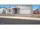 Charming single-story home featuring stone accents, a brick driveway, and a two-car garage at 44713 N 44Th Dr, Phoenix, AZ 85087