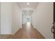 Long hallway with wood-look tile and bright, neutral paint at 44713 N 44Th Dr, Phoenix, AZ 85087