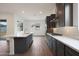 Elegant kitchen featuring a center island, dark cabinetry, and stainless steel appliances at 44713 N 44Th Dr, Phoenix, AZ 85087