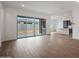 Bright, open living space with tile flooring and sliding glass doors leading to the backyard at 44713 N 44Th Dr, Phoenix, AZ 85087