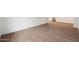 Empty living room showing wood-look tile floor at 44713 N 44Th Dr, Phoenix, AZ 85087