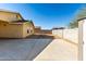 Backyard view with concrete patio and block wall at 12640 W Florence St, Avondale, AZ 85323