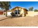 Single-story house with white garage door and desert landscaping at 12640 W Florence St, Avondale, AZ 85323