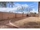 Backyard with grassy area and brick border at 15829 W Carmen Dr, Surprise, AZ 85374