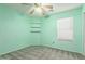 Light green bedroom with carpet, ceiling fan, and window blinds at 15829 W Carmen Dr, Surprise, AZ 85374