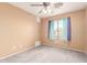 Bedroom with neutral walls, ceiling fan and window at 15829 W Carmen Dr, Surprise, AZ 85374