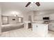 Modern kitchen with white cabinets, stainless steel appliances, and an island at 15829 W Carmen Dr, Surprise, AZ 85374